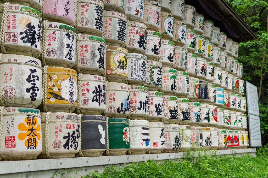 Colorful traditional sake barrels stacked at a Shinto shrine in Japan.